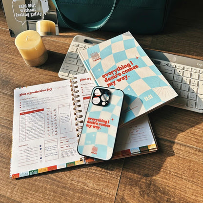 Manifestation Phone Case and Diary laid on table